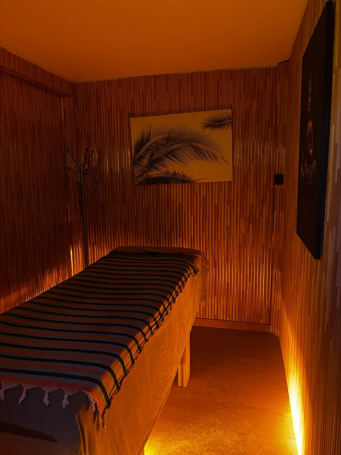 Elegance’s warmly lit individual massage room
